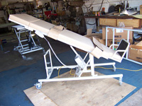 Standard therapy table with velcro leg and torso straps (on an angle)