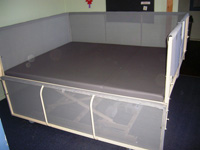 Therapy table with drop down barriers